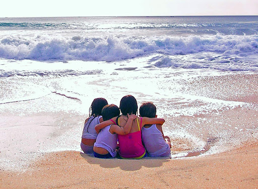 Young friendship on the beach in Bali. 