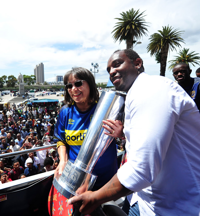 Cape Town Mayor Patricia de Lille holds the trophy with the victorious Cape Town City coach Benni McCarthy during the MTN8 Cup victory parade at the Cape Town City Centre on October 11, 2018.