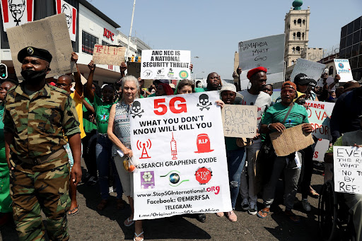 A protester holds up her placard during a protest march in Durban on Monday in opposition to government violating people's freedom of choice