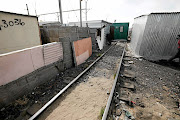 Shacks built on the railway in Langa, Cape Town. 