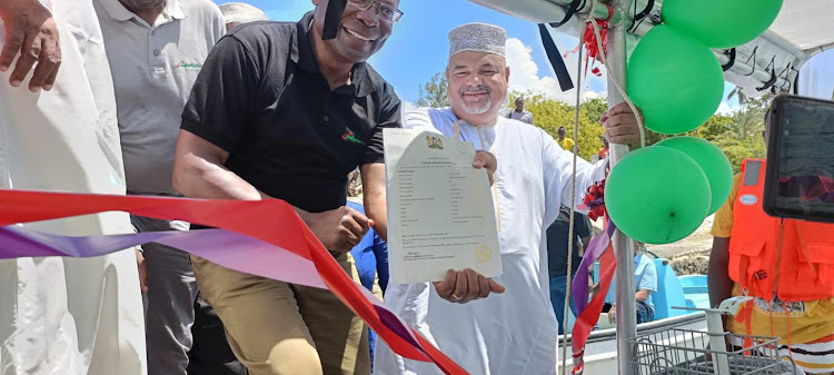 Safaricom Foundation chairperson, Joseph Ogutu with Lamu Governor Fahim Twaha during the launch on Sunday.