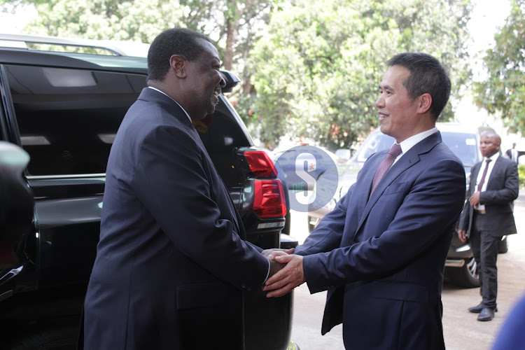 Prime Cabinet Secretary Musalia Mudavadi with Chinese Ambassador to Kenya Zhou Pingjian during the 74th anniversary of the founding of the Peoples Republic of China at the embassy headquarters in Nairobi on September 27, 2023.