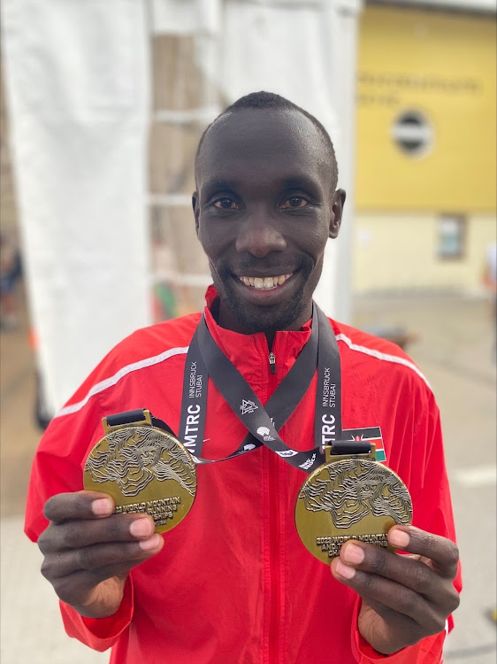 Patrick Kipng'eno displays his medals