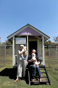 Chubby and Paul Sonderup with Snowy and Mitch,  who are staying in the Royal Suite at Must Love Dogs.