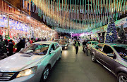 A general view of a shop with Christmas decorations as people buy Santa Claus toys in Cairo, Egypt December 24, 2021.