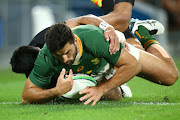 Damian de Allende of the Springboks scores a try during their Rugby Championship match against the All Blacks at Cbus Super Stadium in Gold Coast, Australia on October 2 2021.