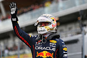 Pole position qualifier Max Verstappen celebrates in parc ferme during qualifying ahead of the F1 Grand Prix of Canada at Circuit Gilles Villeneuve on June 18, 2022 in Montreal, Quebec.