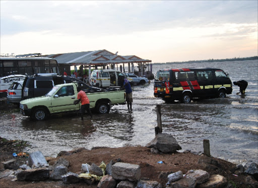 Vehicles are cleaned in Lake Victoria near Luang’ni Beach in Kisumu.