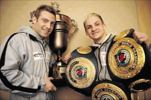 ROOM FOR MORE?: Trainer Colin Nathan and his charge Hekkie Budler, who hopes to add the WBC strawweight belt to his growing collection PHOTO: Tsheko Kabasia