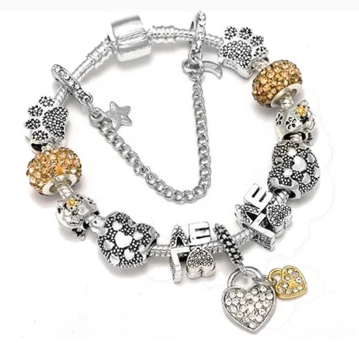Bracelet DIY Attrape-rêves Argenté avec cristal, cœur d'amour, patte de chat et perles. Créez votre bijou unique.
