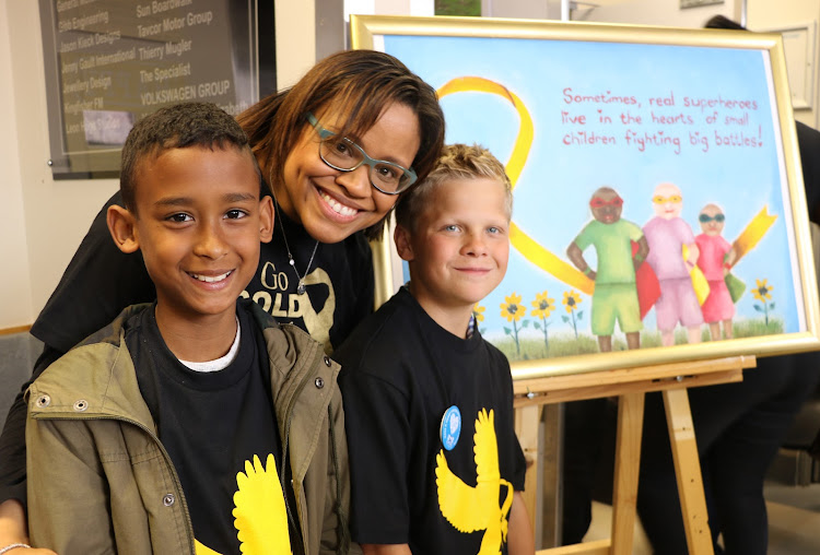 Posing alongside a painting by 12-year-old Erica Girls’ Primary School pupil Adri Beukes at the Provincial Hospital’s Child Cancer Awareness Day on Friday, are, from left, Caleb Kannemeyer, Dr Elmarie Matthews and Brendan Oberholzer