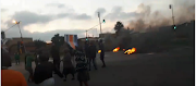 Protesters, angry about the installation of prepaid electricity meters, blocked roads with burned tyres and rocks in Diepsloot, Soweto, early on Friday morning.