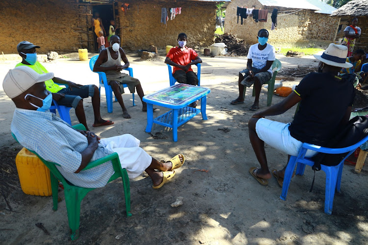 The fishermen at Jumbale's homestead during the interview.