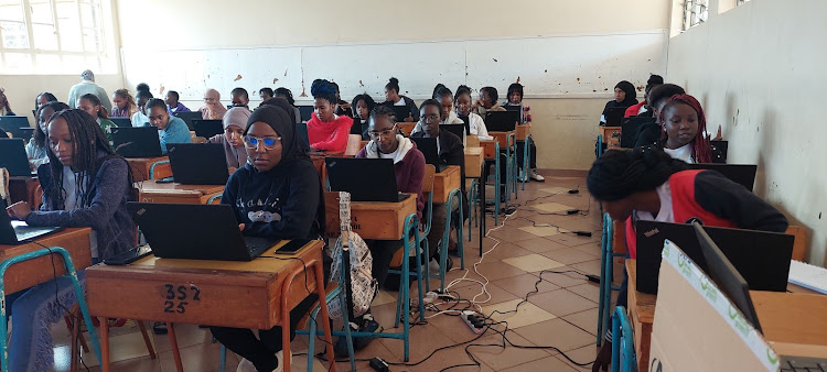 The 50 selected girls for the AGCCI Kenyan Chapter engaged on their laptops during a coding lesson at Kenya High School