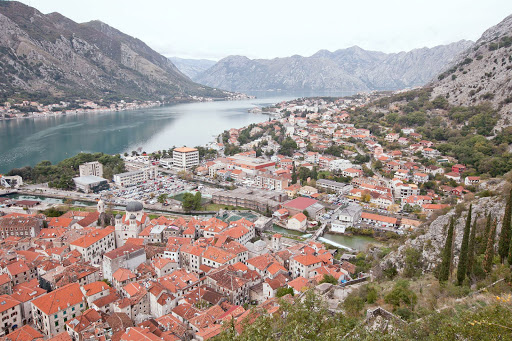 A grand overlook of Kotor and its iconic orange-roofed buildings as seen from two-thirds up the Ladder of Kotor trail. 