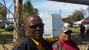 Free State Premier Ace Magashule speaks to reporters from behind a fence erected to separate the dignitaries and the stage from the workers Picture: Kyle Cowan