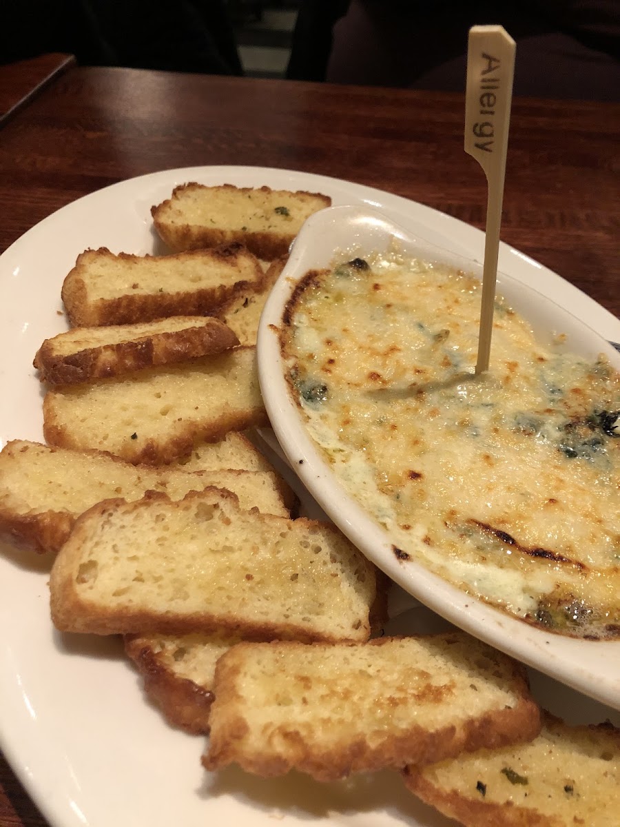 Spinach artichoke dip with homemade GF crispy bread for dipping. Love the allergy toothpick!