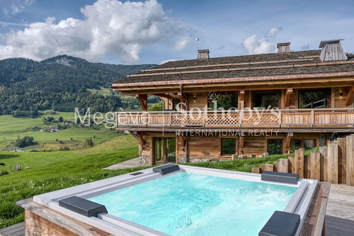 Wooden chalet with outdoor jacuzzi in this luxury chalet for seasonal rental in Megeve ($23,607 - 650 m²)