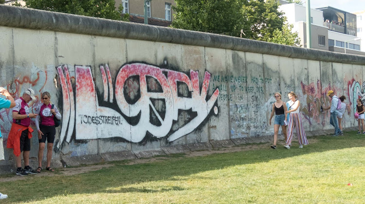 The graffiti-lined Berlin Wall used to divide East and West Berlin until it came down in 1990.