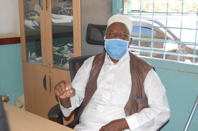 Kenya Livestock Market Council chairman Dubat Amey addresses the press in his Garissa office on Monday.