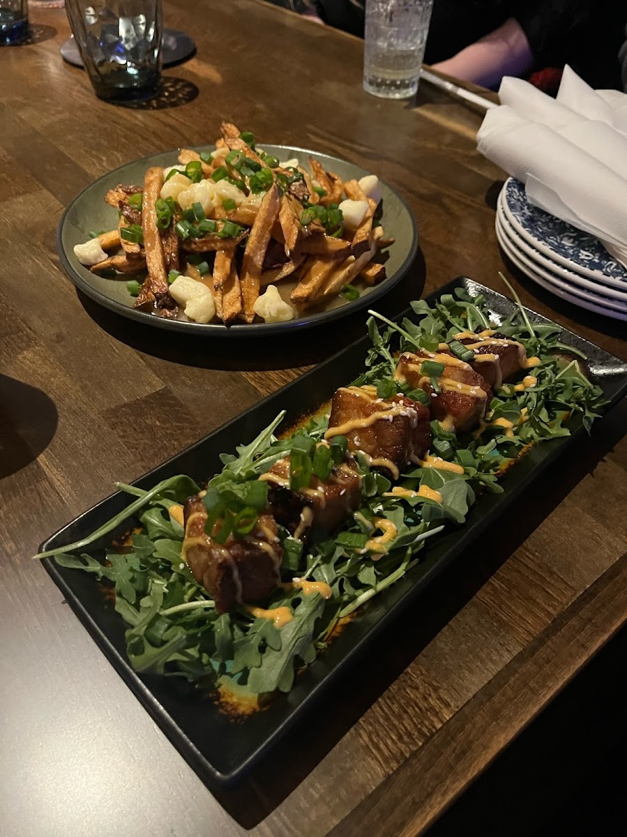 Poutine with fresh cur fries, beef gravy and curds. And the Pork Belly Bits with braised pork, soy glaze and spicy mayo.And its All Gluten Free with dedicated fryers!