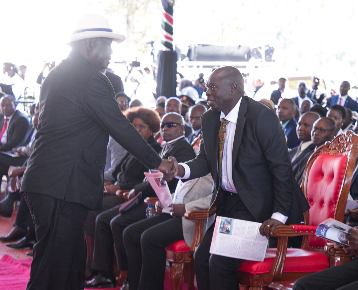 Deputy President Rigathi Gachagua greets Azimio leader Raila Odinga during the funeral of Field Marshal Mukami Kimathi in Nyandarua.