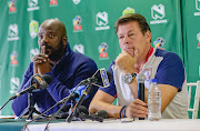 Free State Stars manager Rantsi Mokoena (L) says reports linking his head coach Luc Eymael (R) with the vacant coaching job at Kaizer Chiefs has affected his team in their last seven matches and added that it undermined his team.