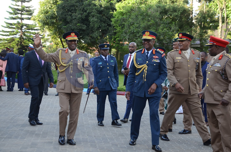 Retired CDF Robert Kibochi alongside CDF Francis Ogolla and other KDF generals as he waves goodbye at the Defence Headquarters on May 5 2023.