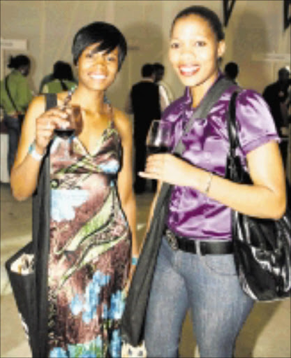 STYLISH SIPPERS: Nomaswazi Tshabalala and Phumlile Dlamini were among the thousands of people who came to appreciate more than 800 wine labels on show at the Standard Bank Soweto Wine Festival at the weekend. Pic. Robert Magwaza. © FrontPage Pix.