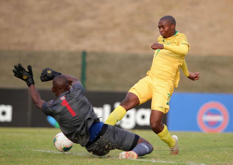 Thabang Sibanyoni of South Africa score a goal pass Ncamiso Dlamini of Eswatini during the 2021 COSAFA Cup match between South Africa and Eswatini at Nelson Isaac Wolfson Stadium.