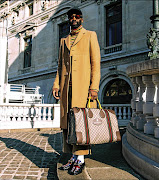 Riky Rick at the Paris Men's Fashion Week dressed in Gucci from top to toe.