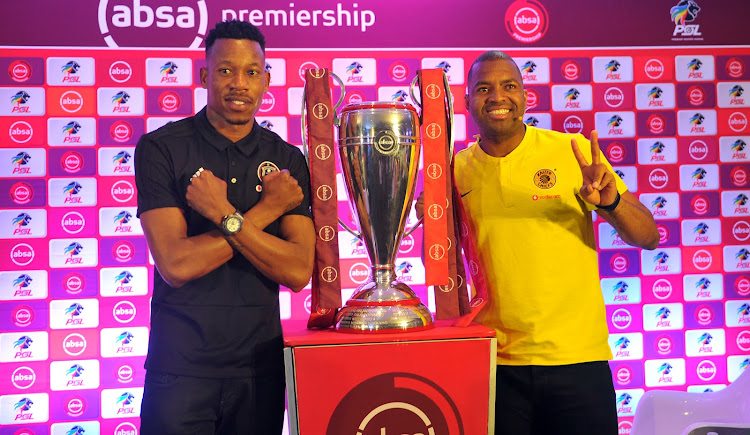 Orlando Pirates captain Happy Jele (L) pose with the Absa Premiership trophy alongside his Kaizer Chiefs counterpart Itumeleng Khune (R) on October 24, 2018 at the Premier Soccer League headquarters in Parktown, north of Johannesburg.