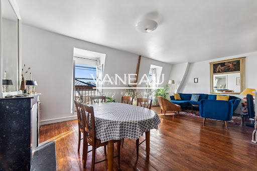 living dining room with parquet floor in this luxury apartment / penthouse for sale in Paris 16ème ($995,318 - 83 m²)