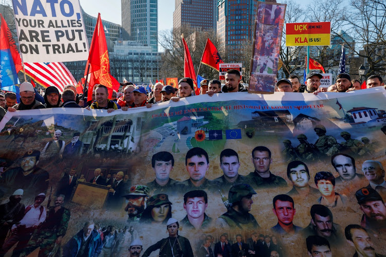 Supporters of former Kosovo president Hashim Thaci protest on the first day of his war crimes trial, in The Hague, Netherlands, on April 3 2023. Picture: REUTERS/PIROSCHKA VAN DE WOUW