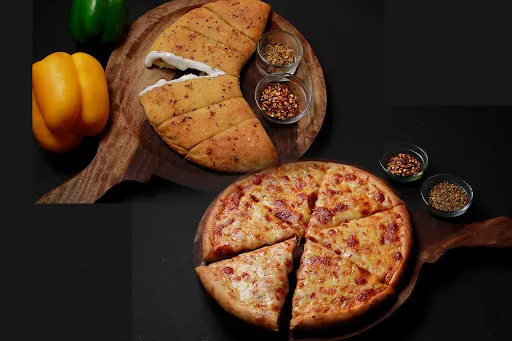 Any Large Veg Pizza+Choice Of Garlic Bread+300ml Coke