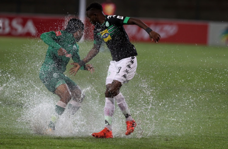 Siyethemba Mnguni of AmaZulu and Ronald Pfumbidzai of Bloemfontein Celtic F.C. during the Absa Premiership match between AmaZulu FC and Bloemfontein Celtic at King Zwelithini Stadium on December 06, 2017 in Durban, South Africa.