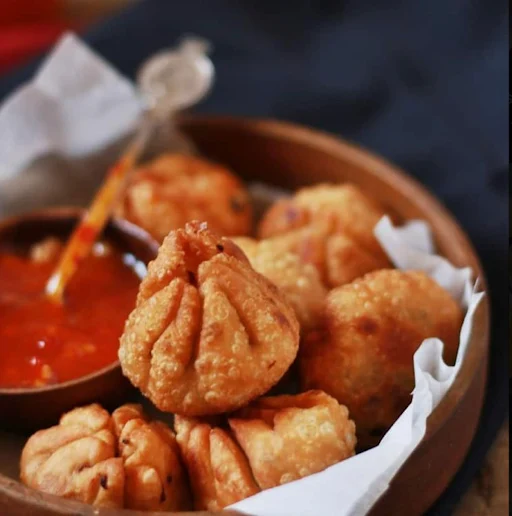 Corn & Cheese Pan Fried Momos With House Chilli And Mayonnaise Dip
