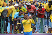 Motjeka Madisha and fans take a selfie during the Absa Premiership match between Mamelodi Sundowns and Bloemfontein Celtic at Loftus Versfeld Stadium on December 16, 2017 in Pretoria, South Africa. 