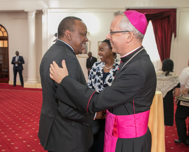 President Uhuru Kenyatta exchange pleasantries with H.E. Archbishop Hubertus Matheus Maria Van Megen, the new Apostolic Nuncio of the Apostolic Nunciature (Holy See) moments after presenting his Letter of Credence at State House, Nairobi on June 12, 2019.