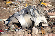 Debris of a plane belonging to Ukraine International Airlines, that crashed after taking off from Iran's Imam Khomeini airport, is seen on the outskirts of Tehran, Iran.