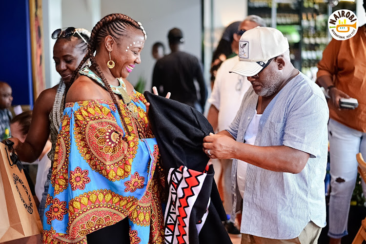 South African musician Jonathan Butler receiving gifts before his performance at the Nairobi International Jazz Festival on October 28, 202