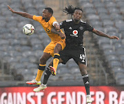 Olisa Ndah of Orlando Pirates challenges Bernard Parker of Kaizer Chiefs in the DStv Premiership Soweto derby match at Orlando Stadium on March 5 2022.