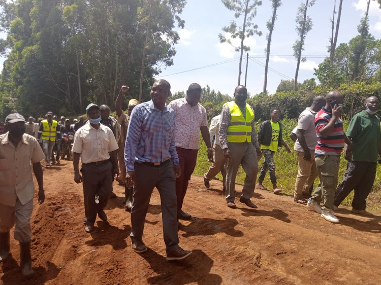 Gichugu MP Gichimu Githinji accompanied by local leaders, road contractor and road workers inspecting a part of the site where the 53-kilometre road stretch shall pass through.