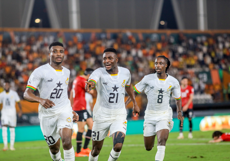 Mohammed Kudus (L) celebrates with Salis Abdul and Majeed Ashimeru (R)