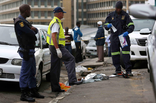 Police and Foensics asses the body of a new born baby girl who was found dead and dumped in the public toilets in the East London CBD yesterday afternoon.picture: STEPHANIE LLOYD.