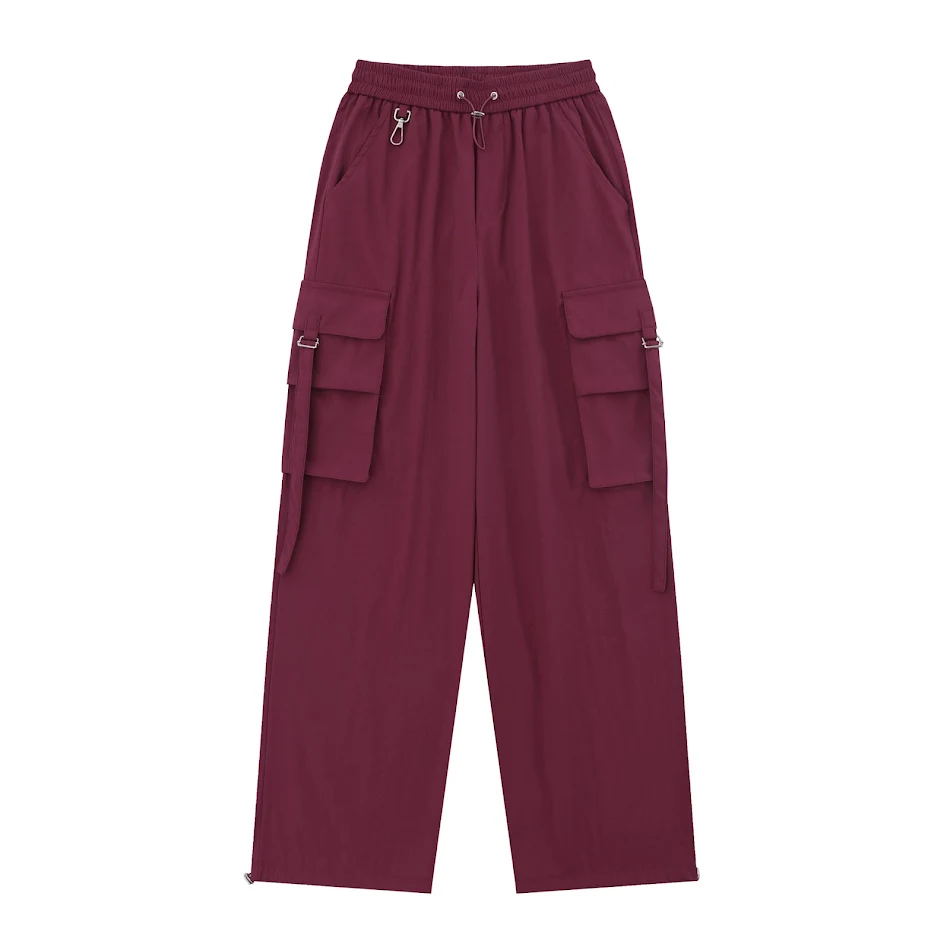 Lockere Overalls mit weitem, geradem Bein, großen Taschen und Band, für bequemen Stil und praktische Aufbewahrung.