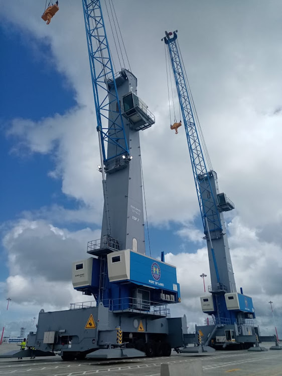 Two of the UHC cranes shortly after they were offloaded from the MV United Heavy Lift-UHL Finesse.