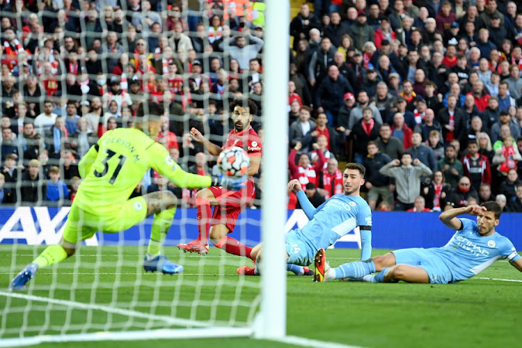 Mohamed Salah of Liverpool scores his sides second goal during the Premier League match against Manchester City at Anfield on October 3, 2021 in Liverpool