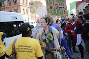 Caiti Woollcott gestures to protesters opposing the legalisation of cannabis outside the North Gauteng High Court after the dagga couple challenged the constitutionality of dagga laws. Picture Credit: Alaister Russell