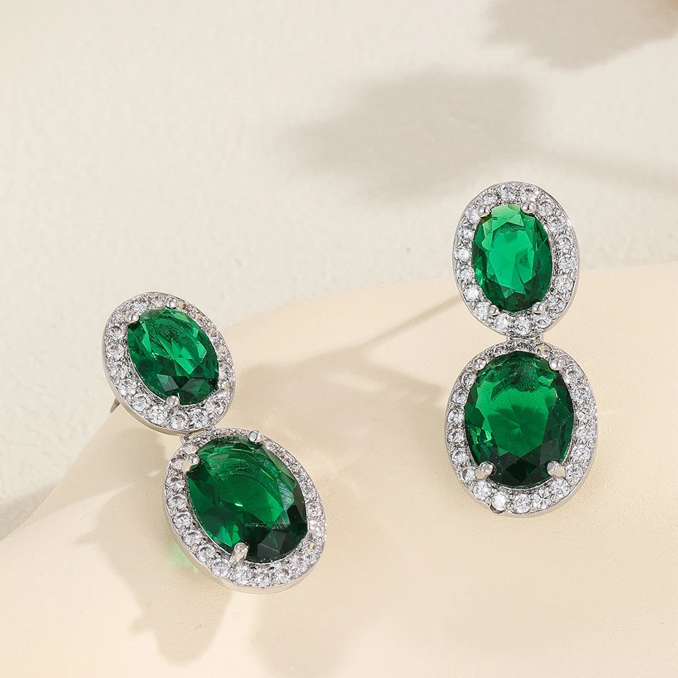 Pendientes de moda SATINE con circonita ovalada a color, avanzados y populares, para un look sofisticado y elegante en cualquier ocasión.